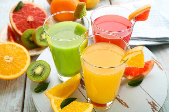Orange, grapefruit and kiwi fruit juice blends in glasses