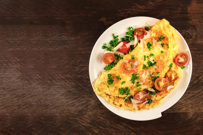 an omelette with fresh tomatoes and cheese