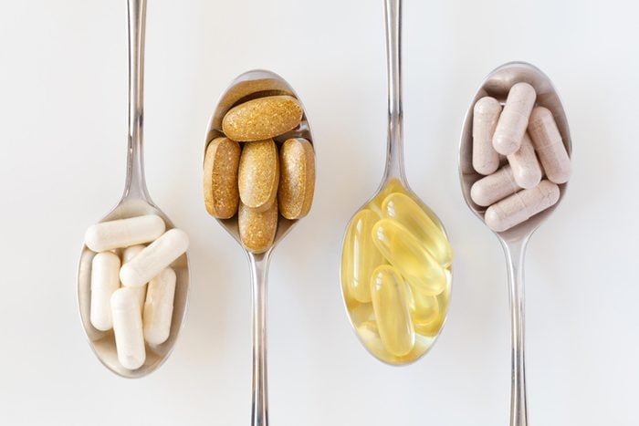 teaspoons holding different types of supplements