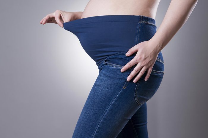 pregnant woman wearing stretch-top jeans