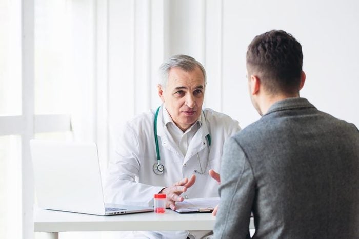 doctor talking to male patient