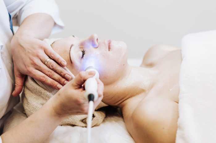 woman getting laser therapy treatment