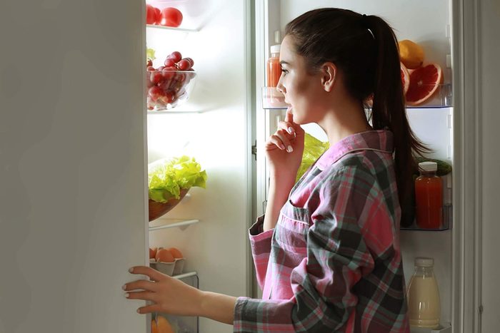 woman looking at fridge