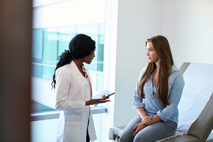 woman doctor speaking to woman patient
