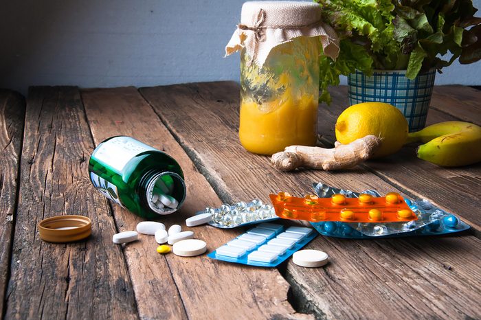 vitamin tablets on a rustic wood table