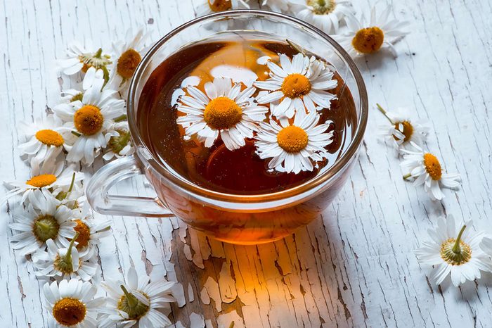 chamomile flowers floating in tea