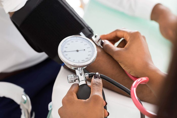 doctor using a blood pressure cuff