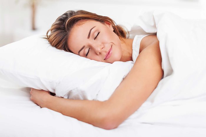 woman sleeping peacefully on her stomach