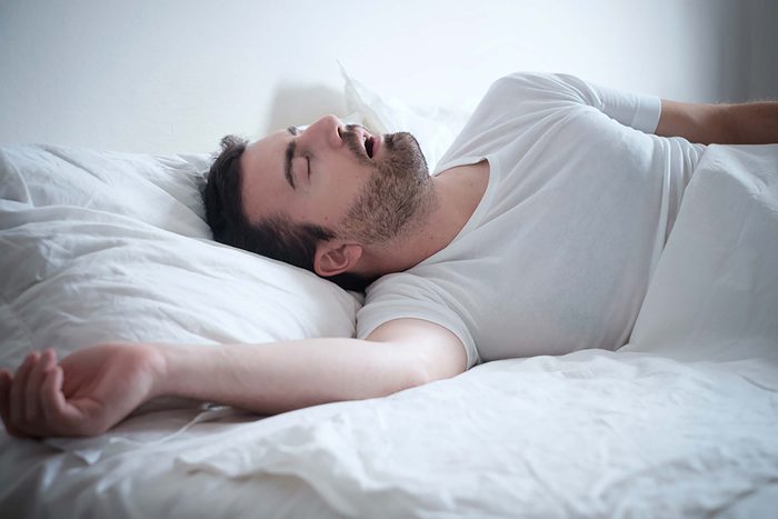 man sleeping with mouth open, sleep apnea, snoring