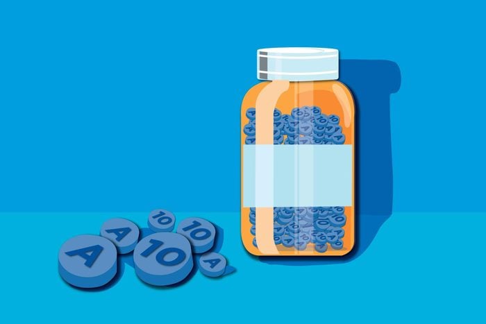 Illustration of a pill bottle and pills.
