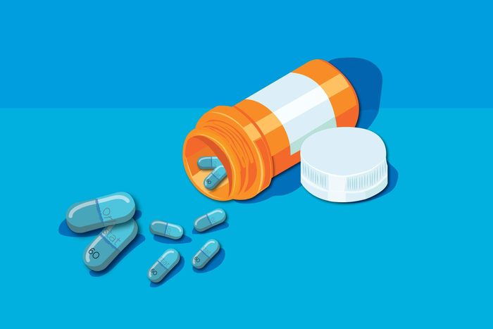 Illustration of pill bottle with orlistat capsules.