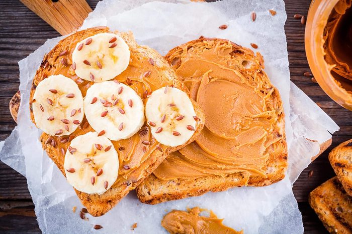 toast with peanut butter, banana, and flaxseeds