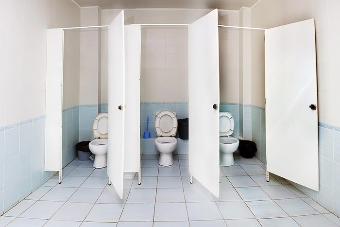 three empty stalls in a bathroom
