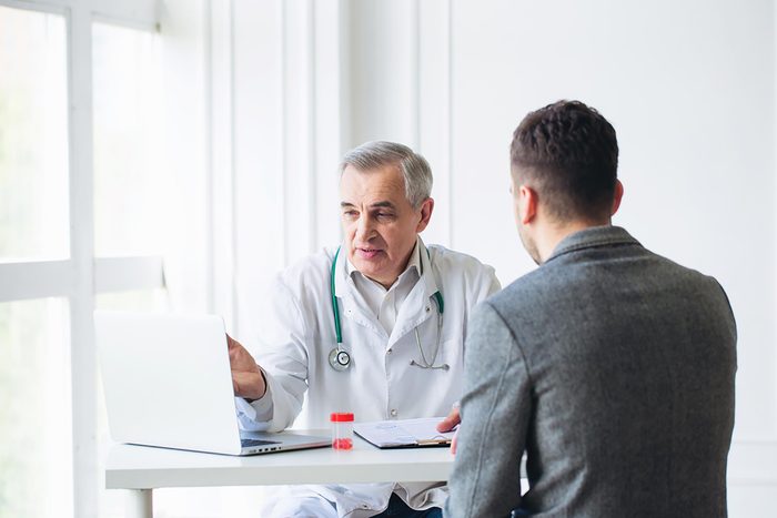 Doctor discussing a diagnosis with a male patient
