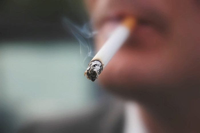 close up of cigarette in man's mouth