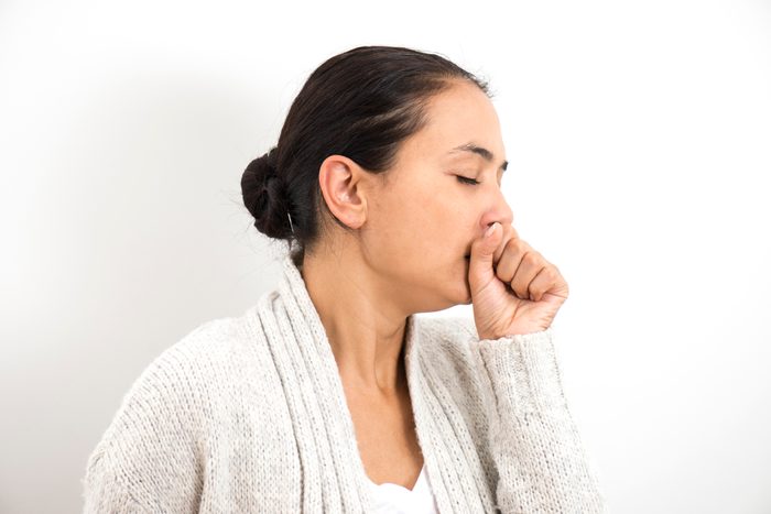 woman coughing clearing throat