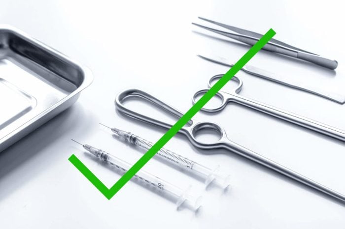 Surgical tools with a check mark through it.