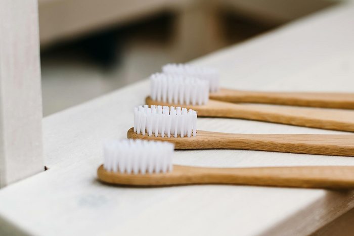 wooden toothbrushes with white bristles