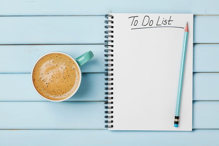 Coffee cup and notebook with to do list