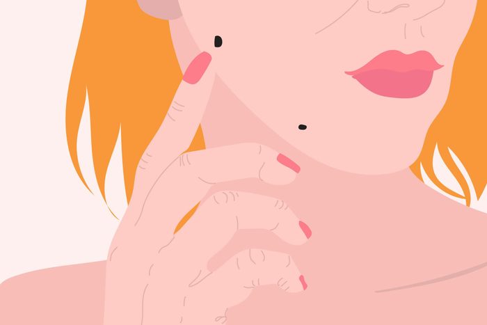 illustration of woman checking moles on her face