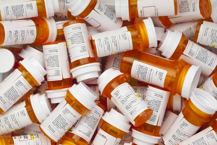 Dozens of prescription medicine bottles in a jumble