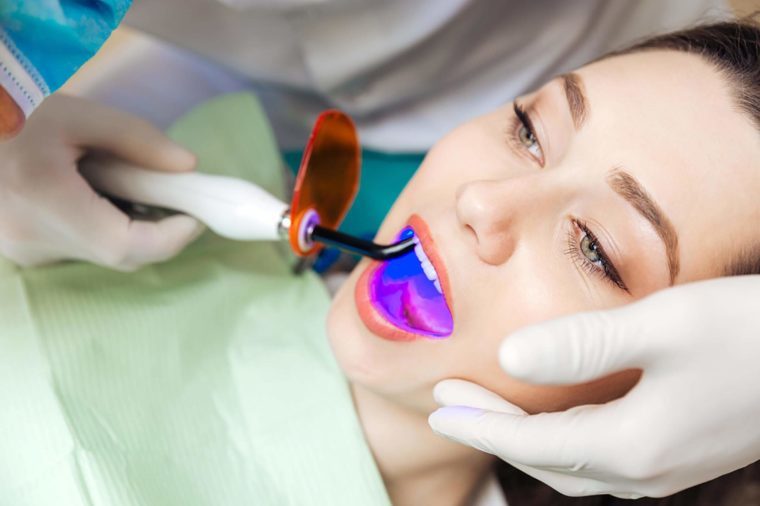 dentist working on a woman's teeth