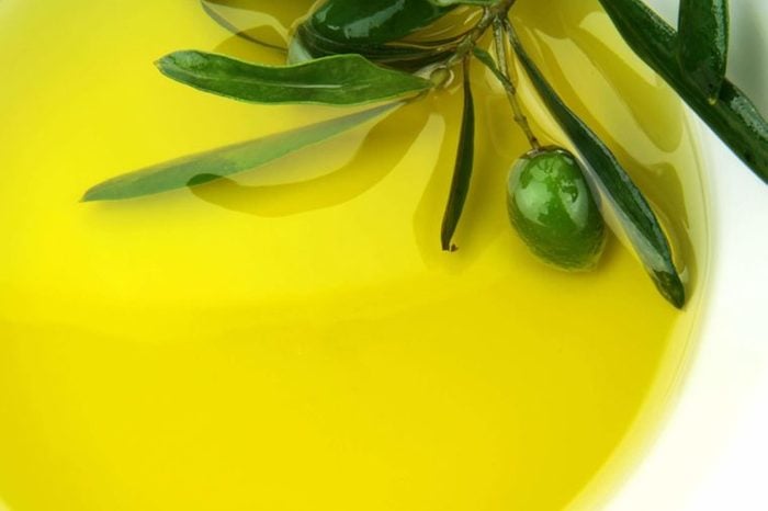 dish of olive oil with olive