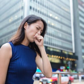 Woman cough at outdoor