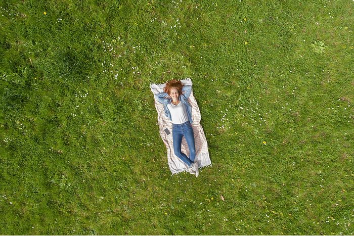 Woman-laying-on-grass