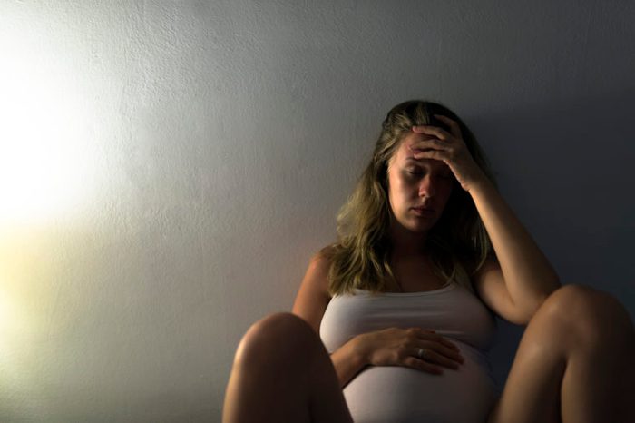 pregnant woman struggling with pregnancy insomnia in the middle of the night