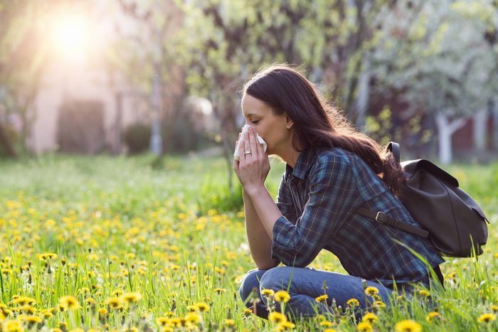 woman allergies tissue outdoors grass