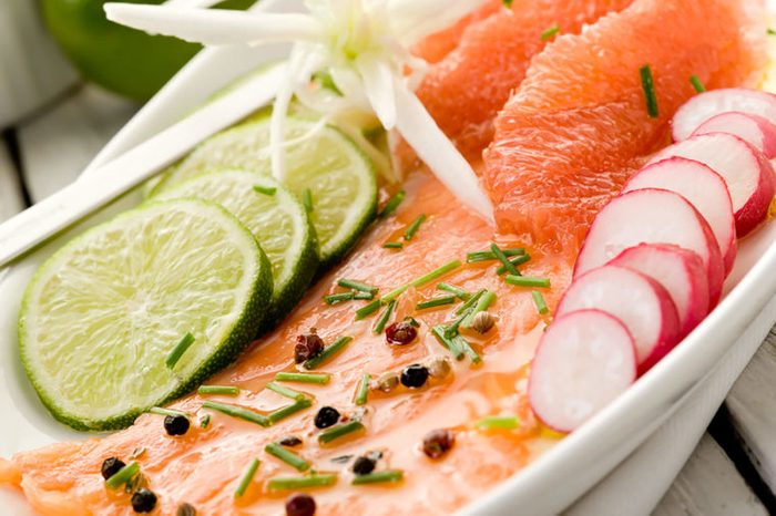 Salmon with grapefruit slices.