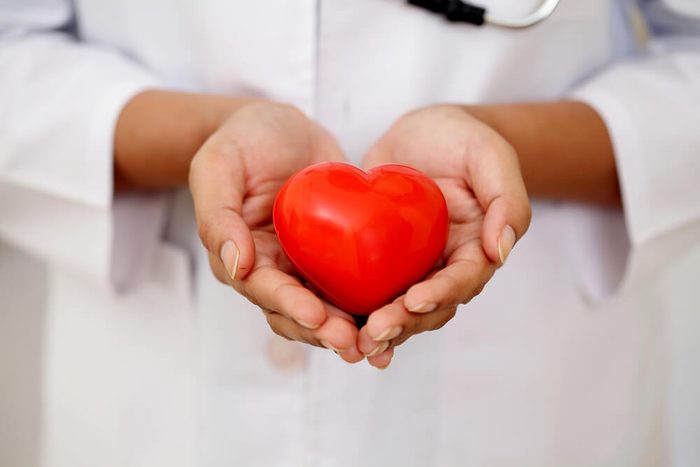 Red heart shape in doctor's hands
