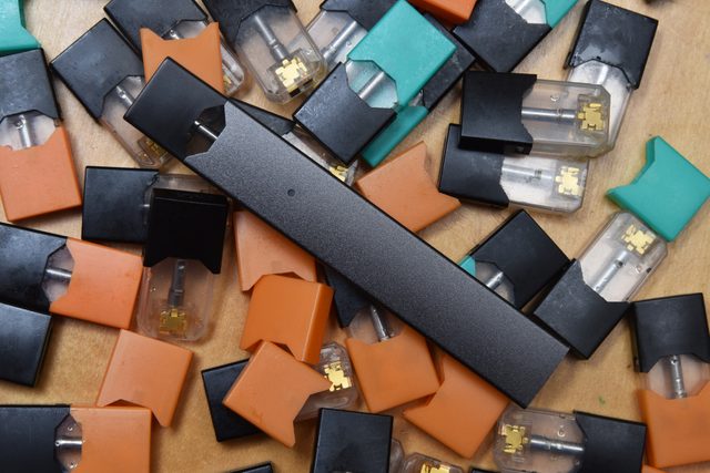 overhead shot of juul and juul pods vaping concept