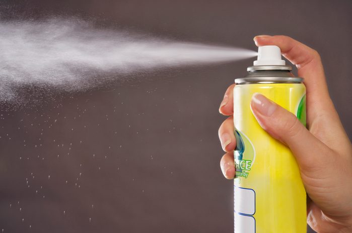 close up of aerosol can spraying