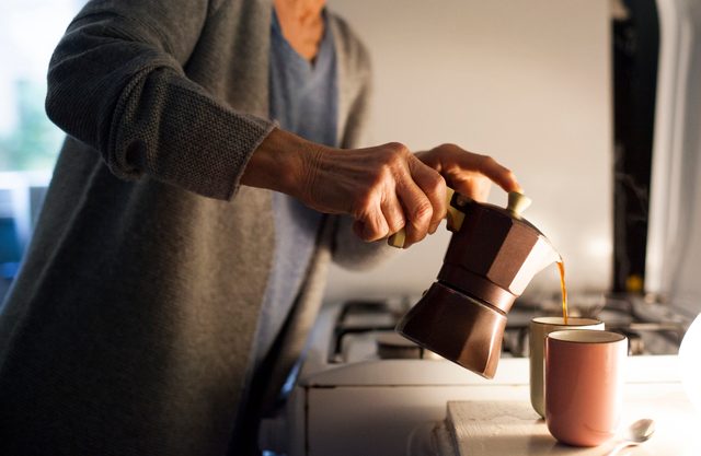 woman pouring her morning coffee