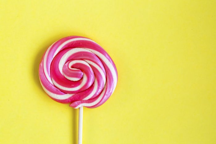 pink and white swirled lollipop
