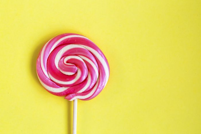 pink and white swirled lollipop