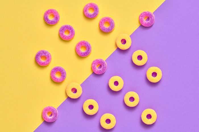 Gummy Candies background, Sweets. Creative Flat lay. Summer Party, Purple Birthday Layout. Bright Colorful. Fun Trendy fashion Style. Minimal. Pop Art