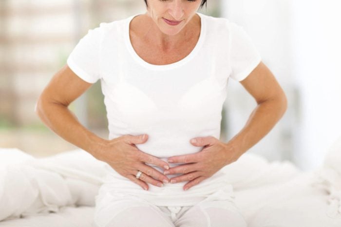 mid age woman having stomach pain