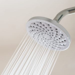 close up of shower head running water