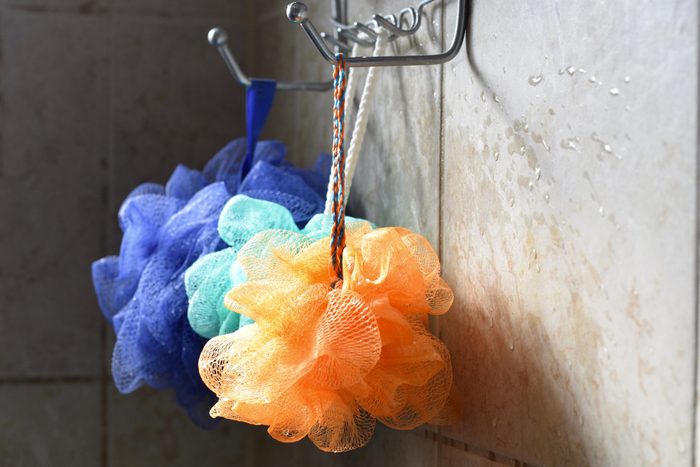 loofahs hanging in the shower