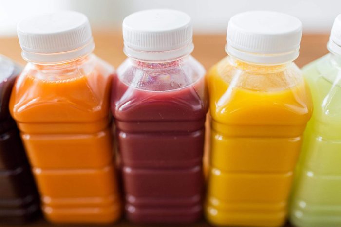 Bottles of colorful fruit and vegetable juices.