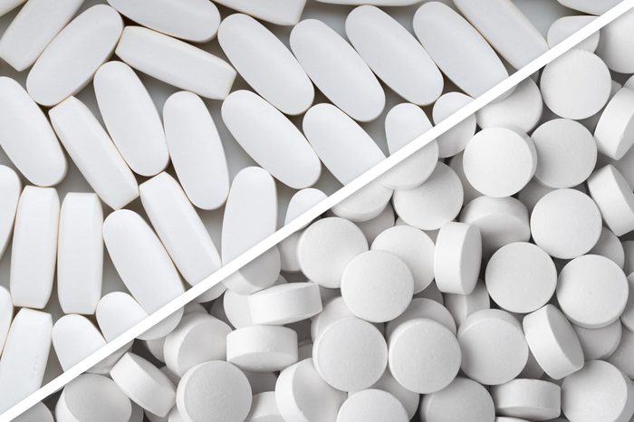 white oblong pills next to white round pills