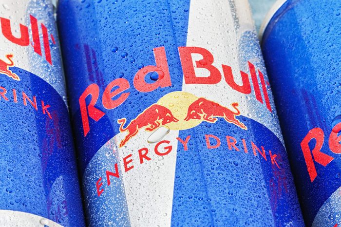 Moscow, Russia - FEBRUARY 27, 2014: Red Bull is an energy drink sold by Austrian company Red Bull GmbH, created in 1987. The most popular energy drink in the world.