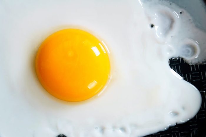 Fried egg on a frying pan. A close up.