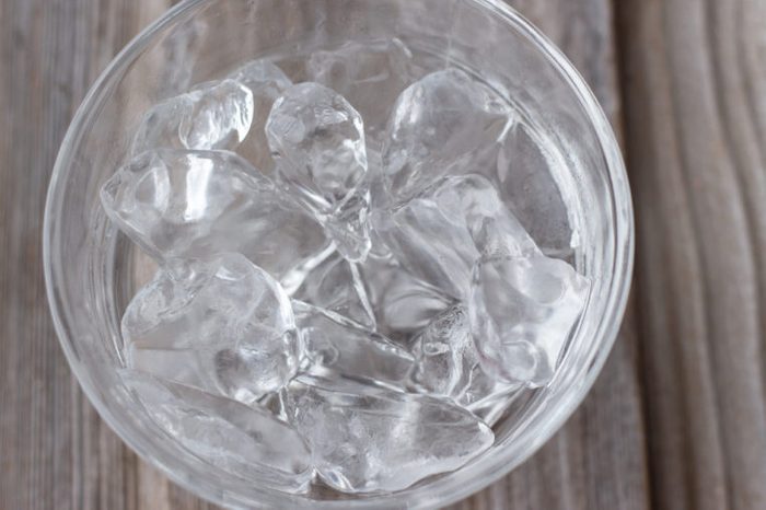 Glass bowl with ice cubes 