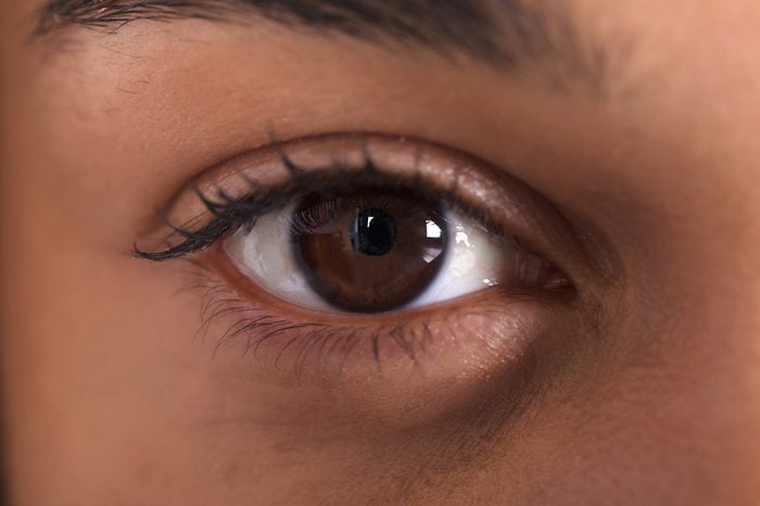 Close-up image of a dark brown eye.