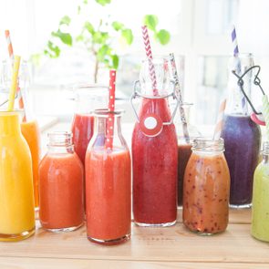 Variety of fresh smoothies in rainbow colors