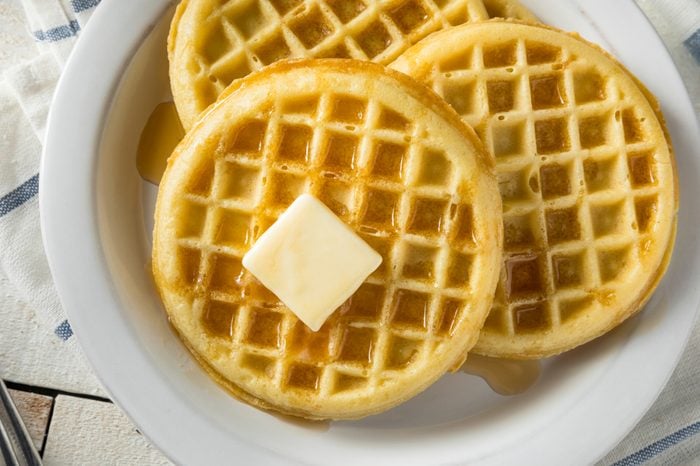 Brown Hot Freezer Waffles with Butter and Maple Syrup